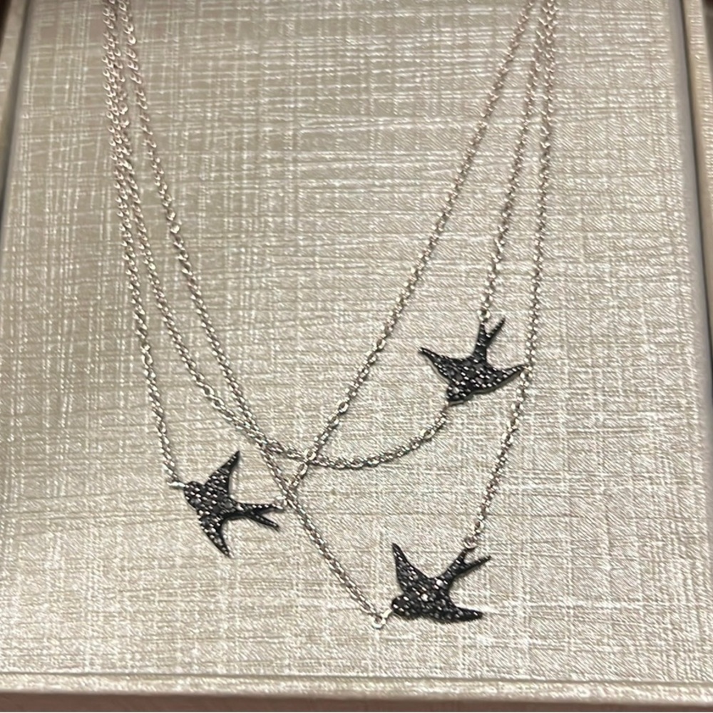 Whimsical three strand reversible bird necklace from Zales.